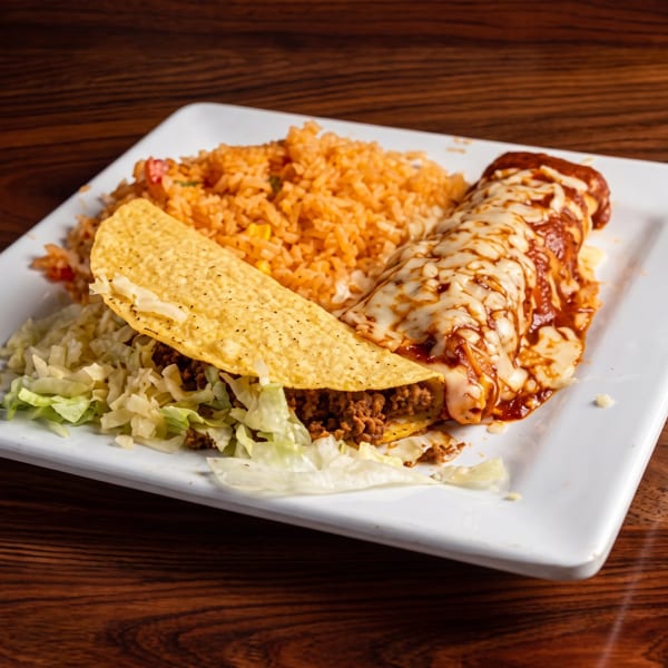 A plate with a hard-shell taco, an enchilada covered in melted cheese, and a side of rice.